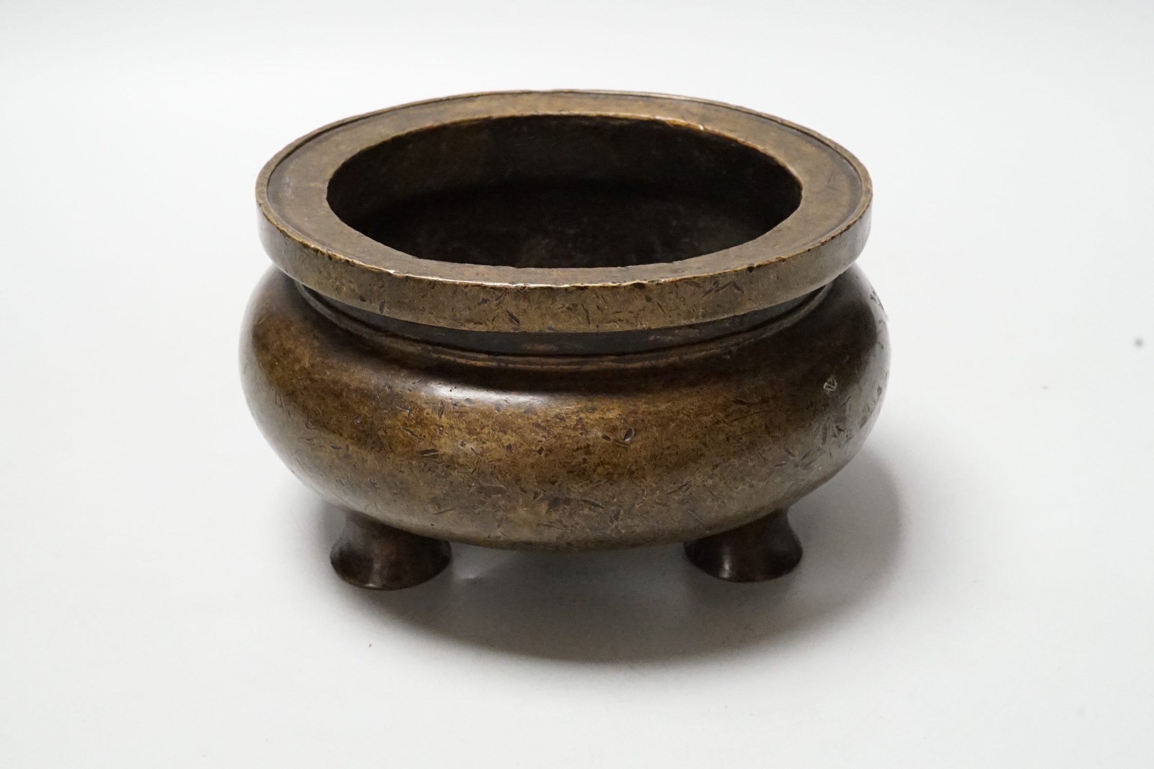 A Chinese bronze censer, ding, 14cm diameter